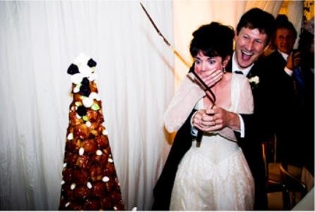 Victoria Hamilton and her Husband Mark cutting cake at their wedding